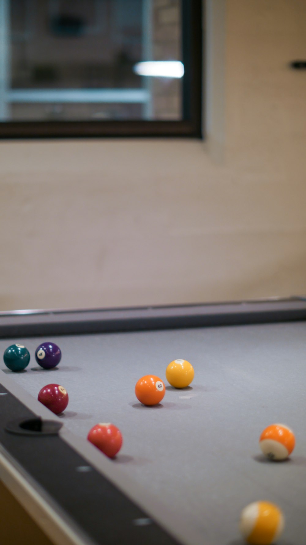 billiard balls on billiard table