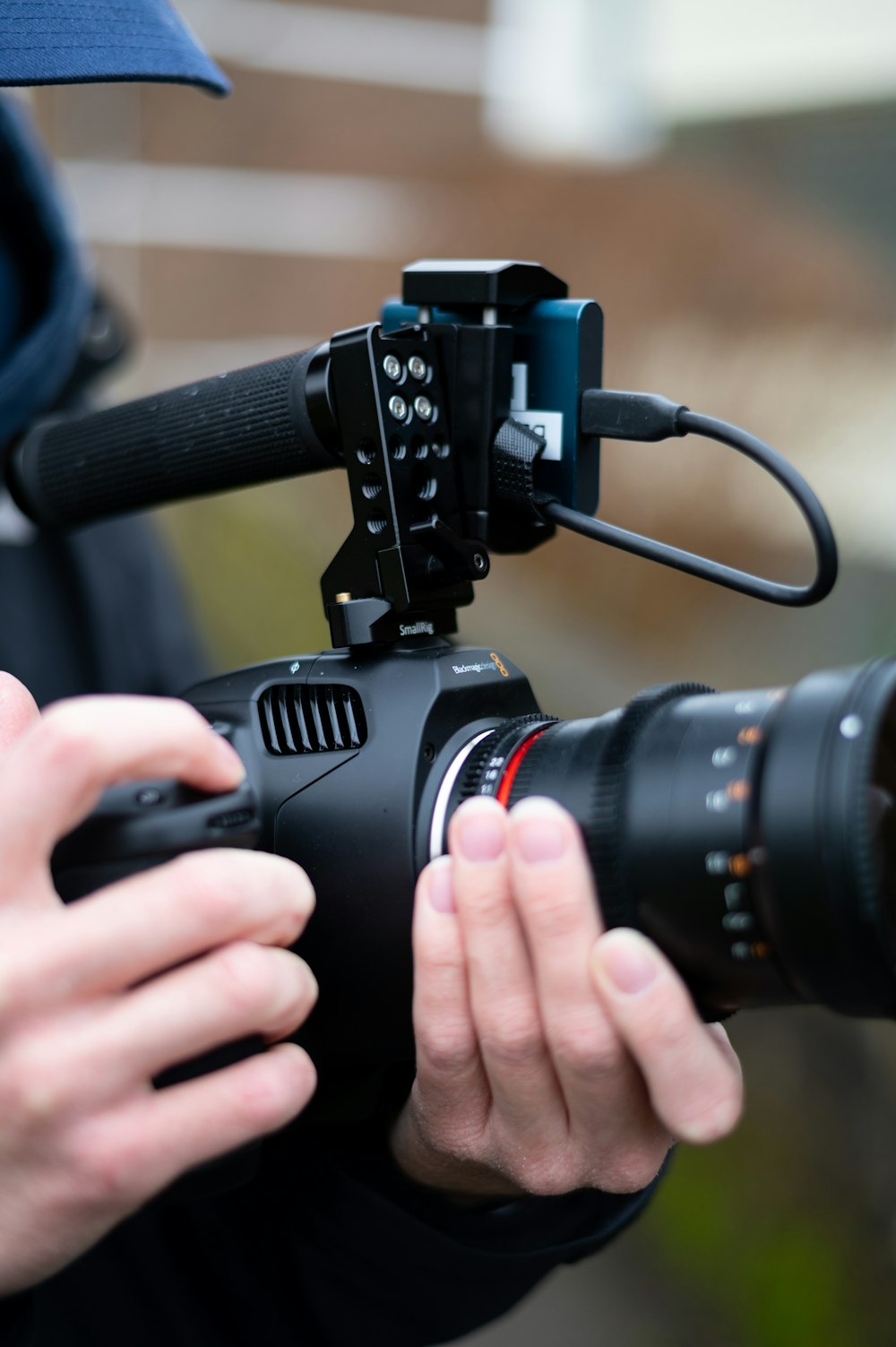 person holding black nikon dslr camera