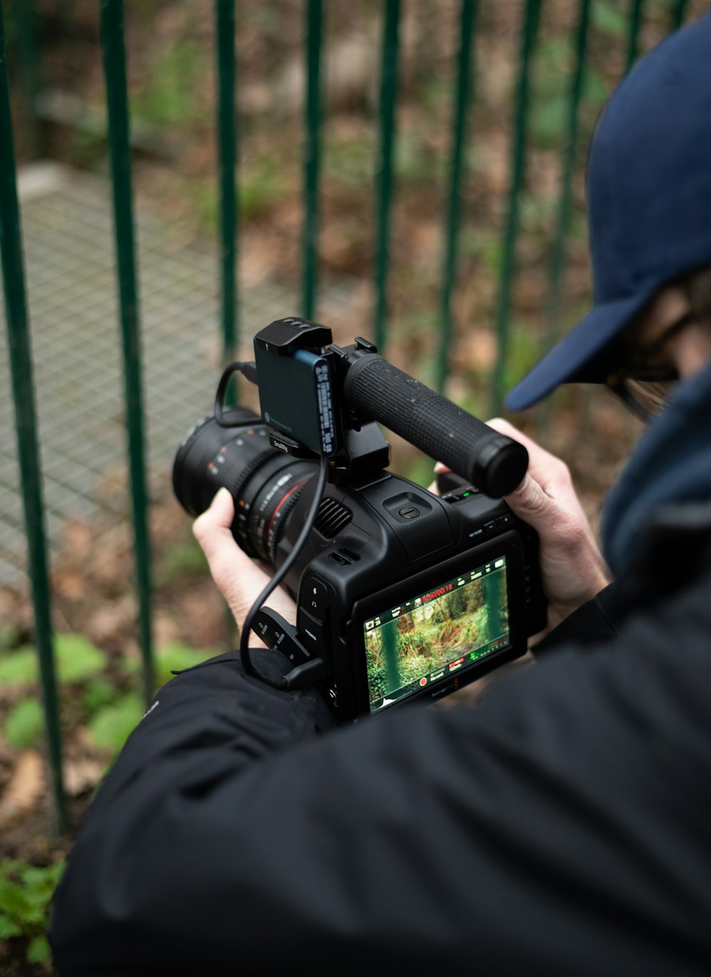 person holding black dslr camera