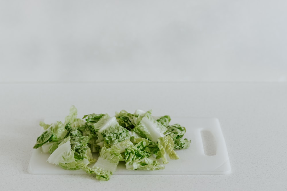 green vegetable on white plastic container