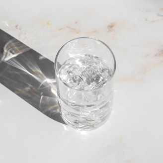 clear drinking glass on white table