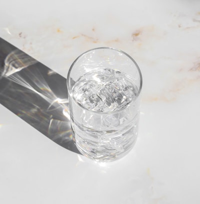 clear drinking glass on white table