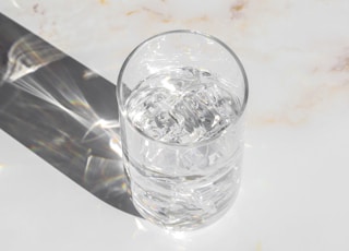 clear drinking glass on white table