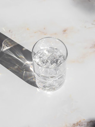 clear drinking glass on white table