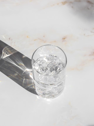 clear drinking glass on white table
