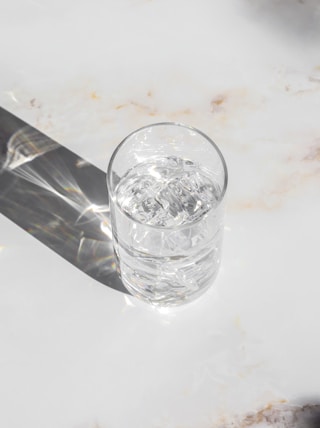 clear drinking glass on white table