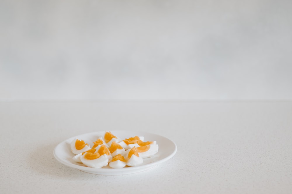 sliced fruit on white ceramic plate