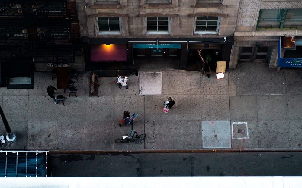 people walking on sidewalk during daytime