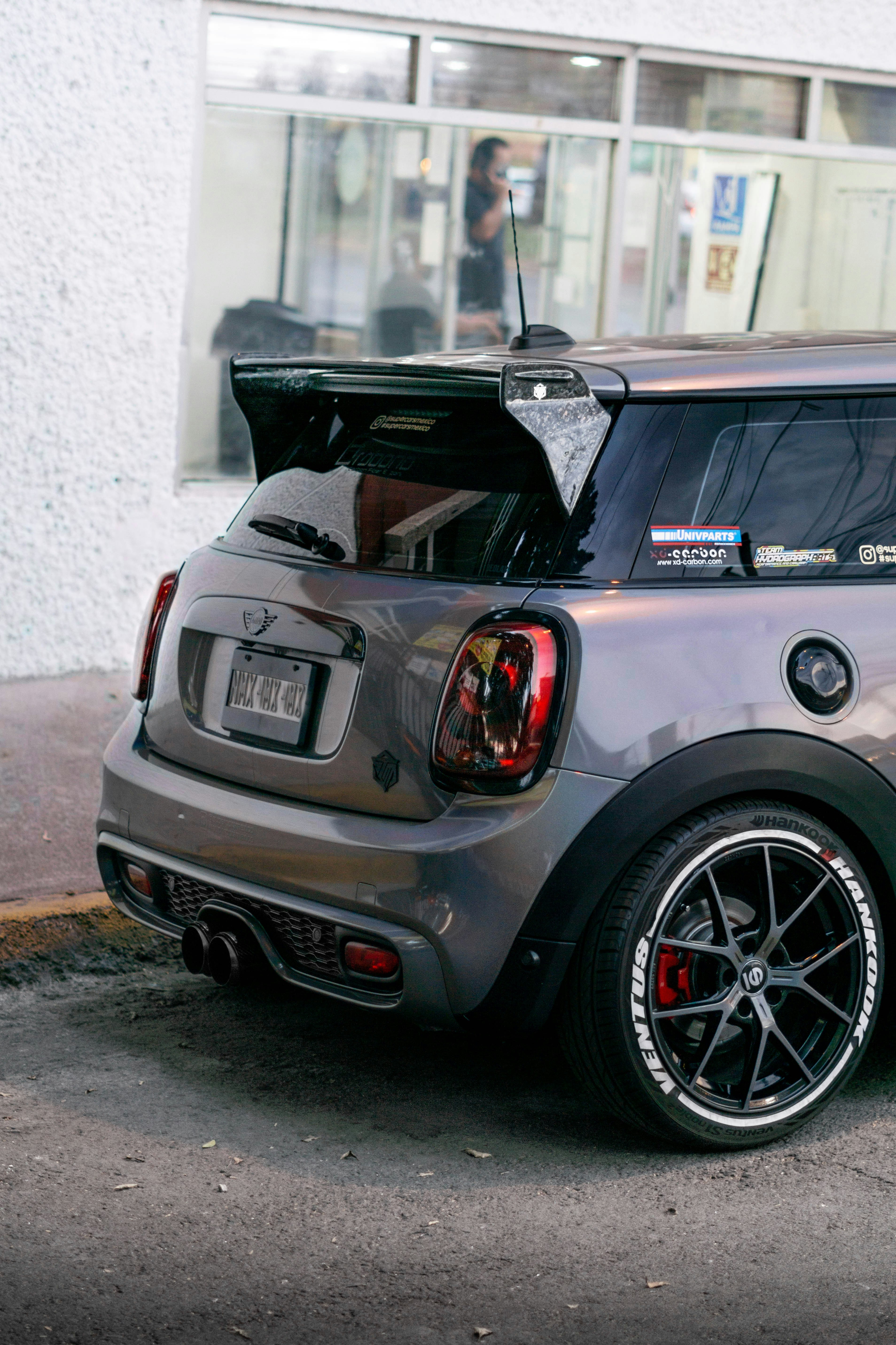 black bmw x 6 parked on gray concrete pavement