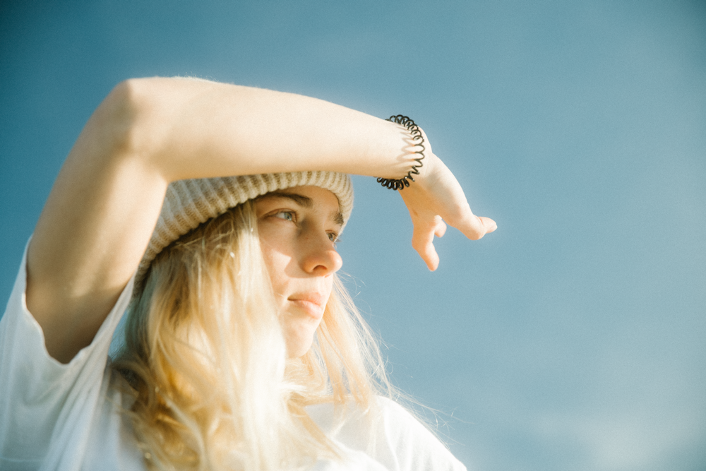 woman in white dress wearing white hat