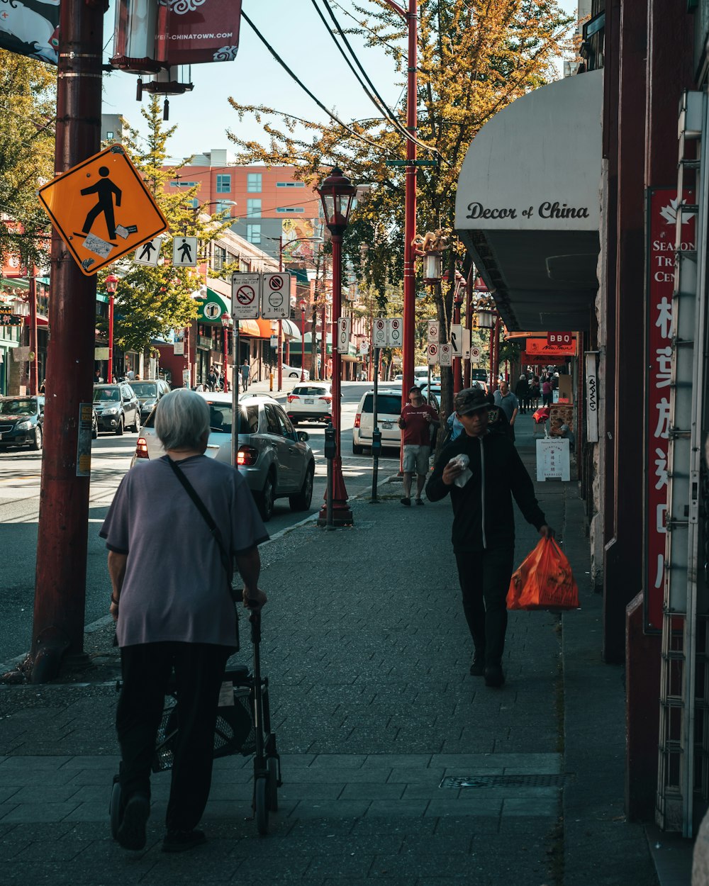 people walking on sidewalk during daytime