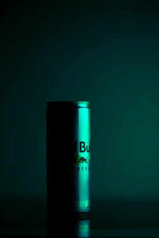 A cinematic shot of a branded food product with dramatic shadows and rich contrast.