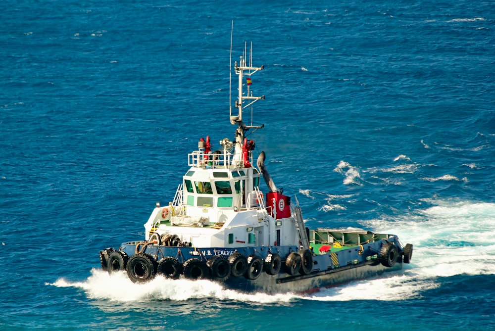 white and black ship on sea during daytime