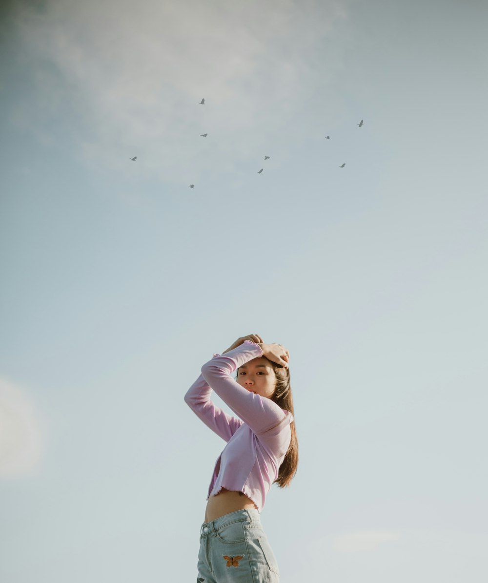 woman in white long sleeve shirt and white pants