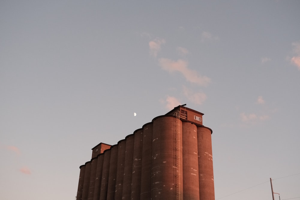 brown concrete building under gray sky