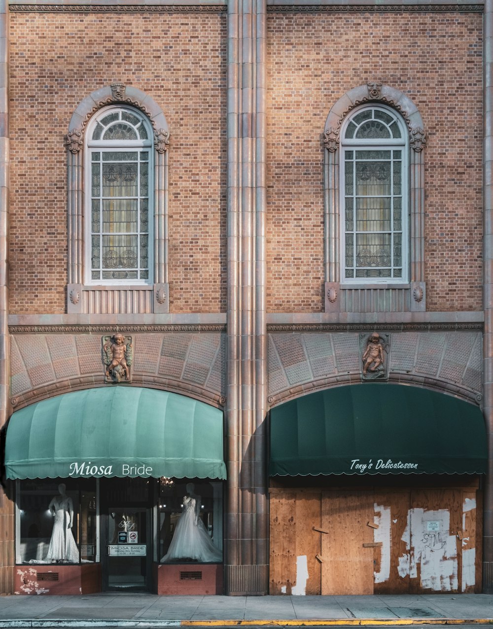 brown brick building with glass windows