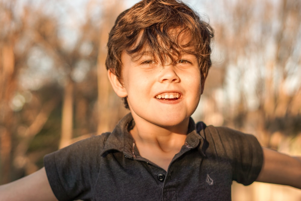 boy in black polo shirt