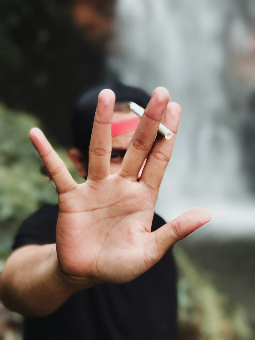 persons left hand with white manicure