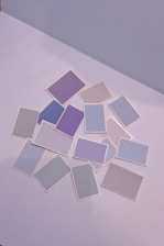 Bright, pastel-toned grid of 16 rounded cards each featuring a playful MBTI personality icon.