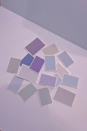 A panoramic shot of a vibrant trading card collection laid out on a fiery-orange background.