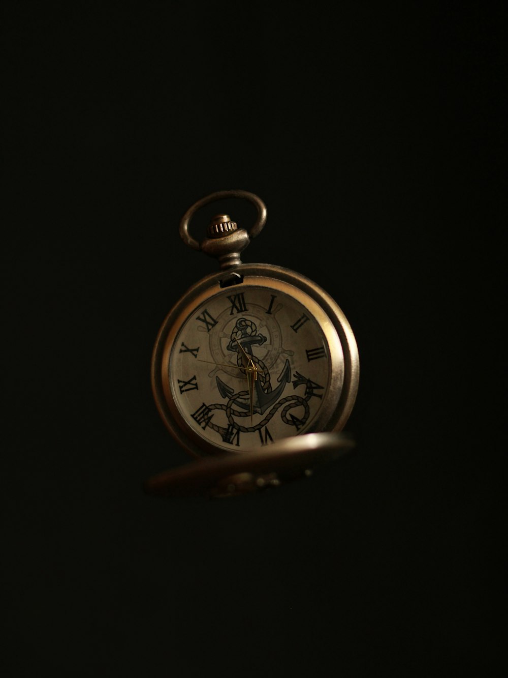 gold and silver pocket watch