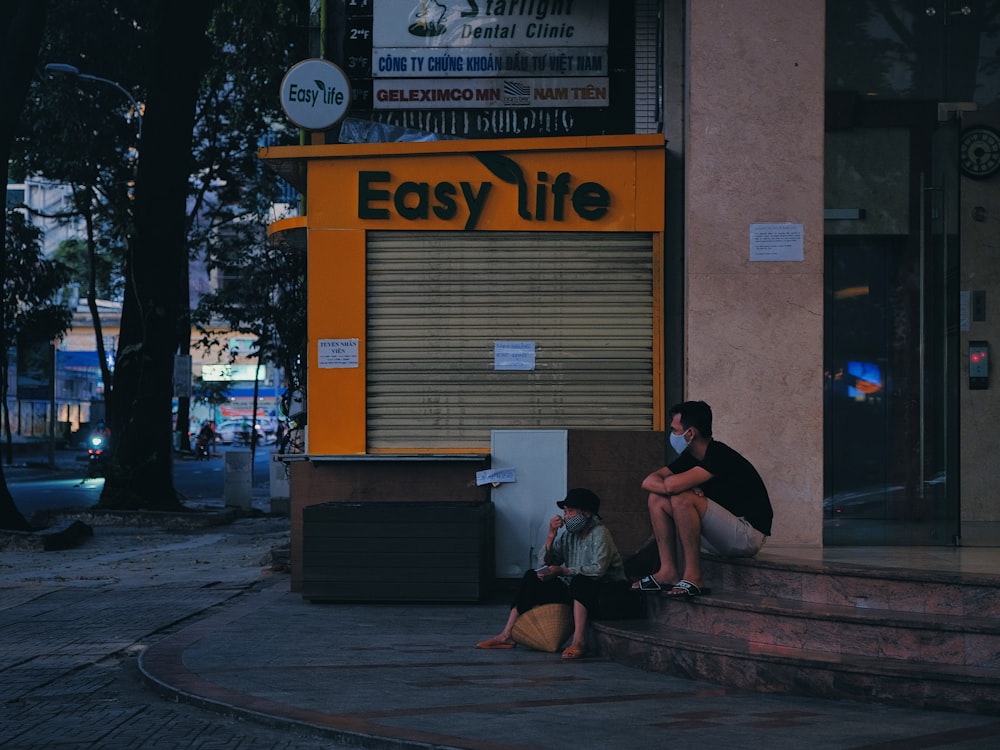 woman in black shirt sitting on brown wooden bench