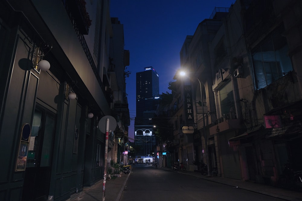 people walking on sidewalk during night time