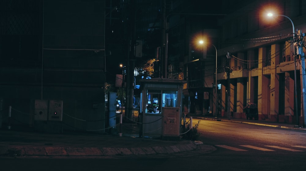 black and white bus on road during night time