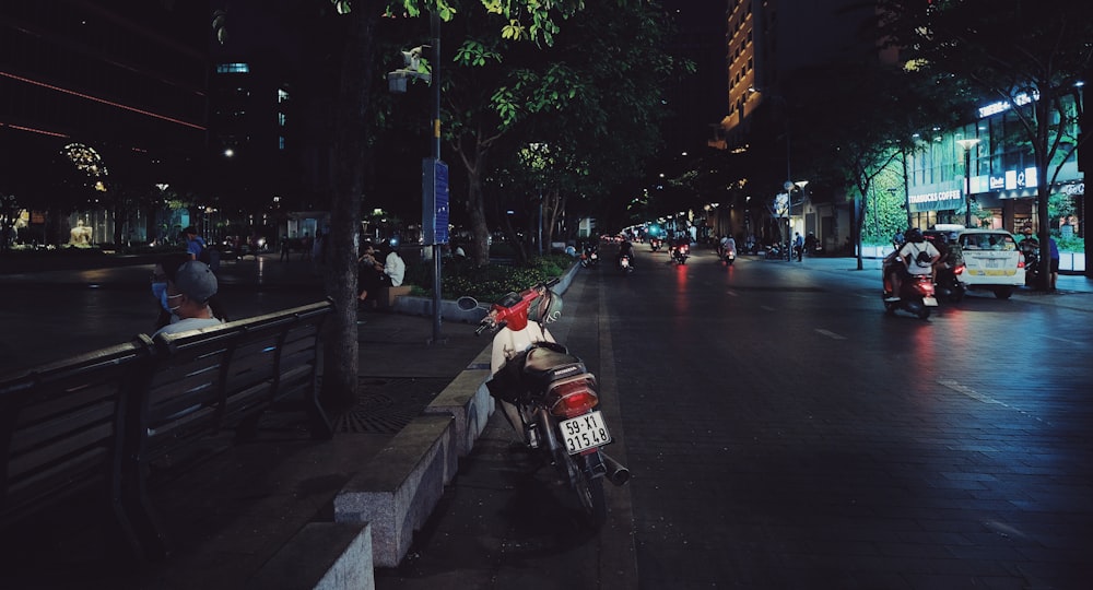 man in red jacket riding motorcycle on road during daytime