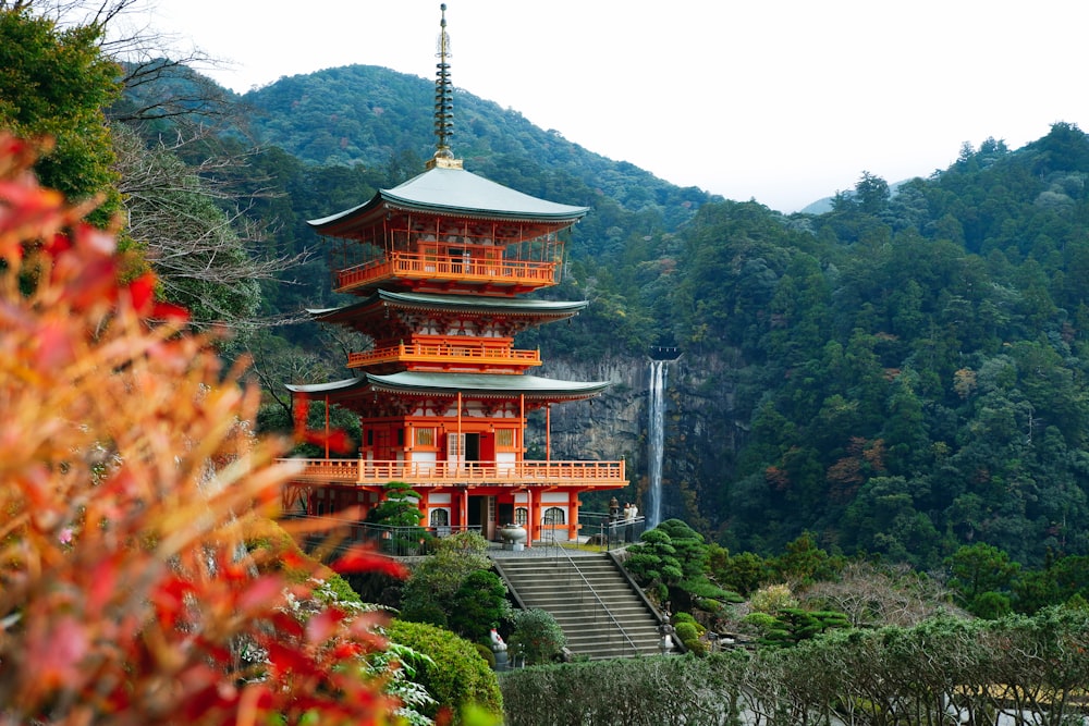 brown and white temple surrounded by green trees during daytime