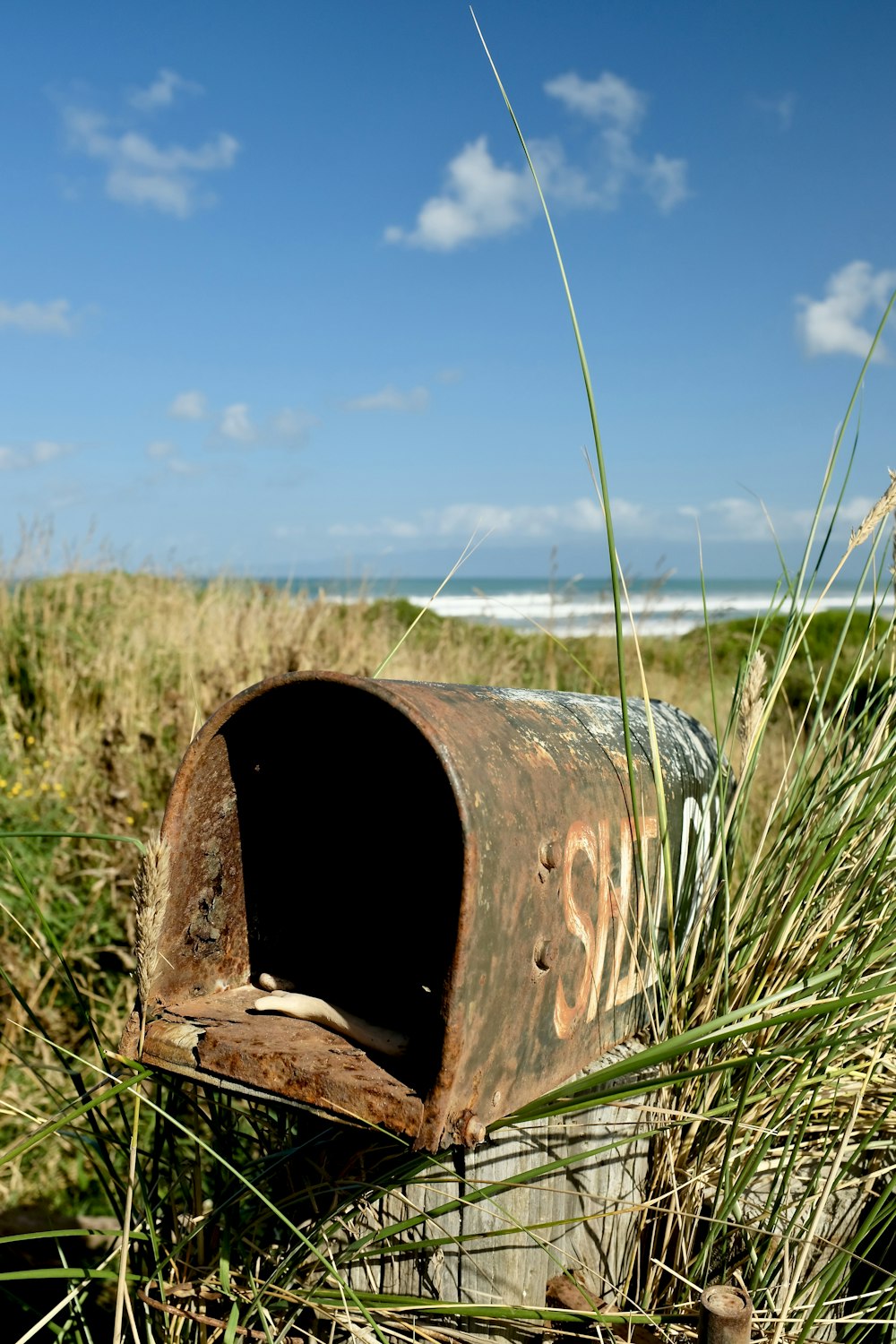 brown wooden box on green grass field during daytime