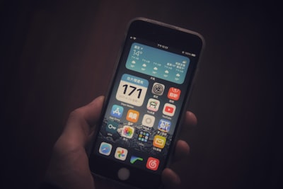 person holding black iphone 5