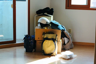 black and blue backpack on brown wooden table