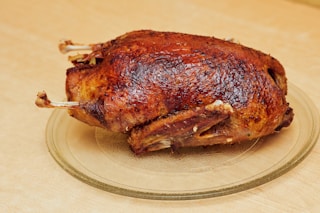 roasted chicken on white ceramic plate