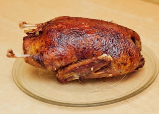 roasted chicken on white ceramic plate