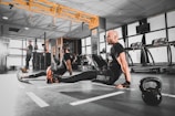 woman in black tank top and black leggings doing exercise