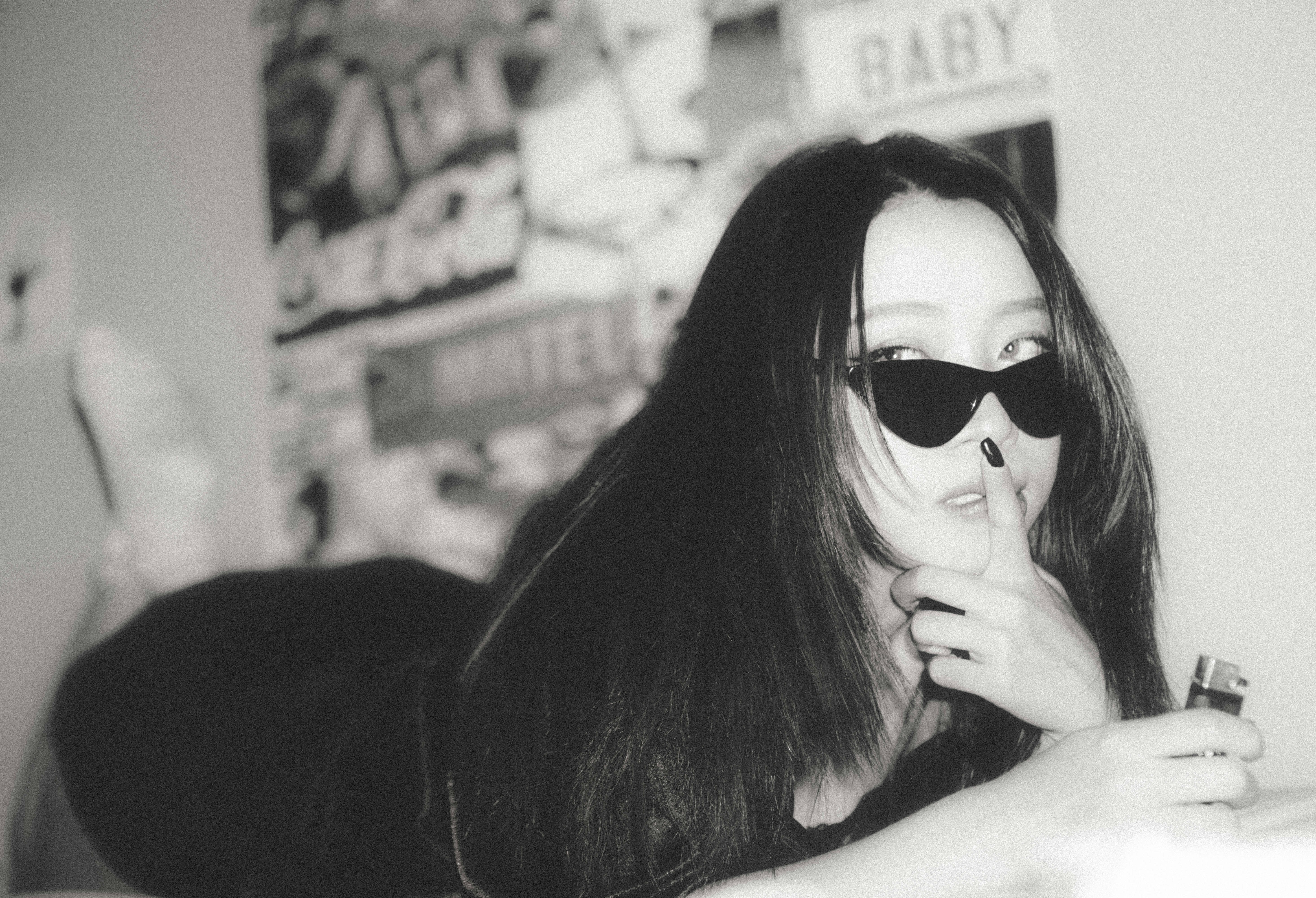 woman in black sunglasses and black shirt