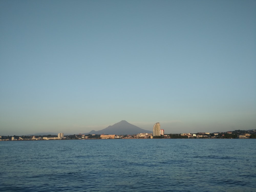 city skyline across body of water during daytime