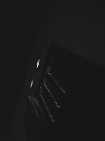 An atmospheric illustration of a dark dungeon corridor from one of the adventure maps.