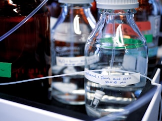 clear glass bottles on white table