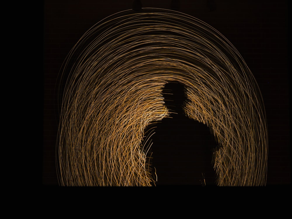 man standing on brown tunnel