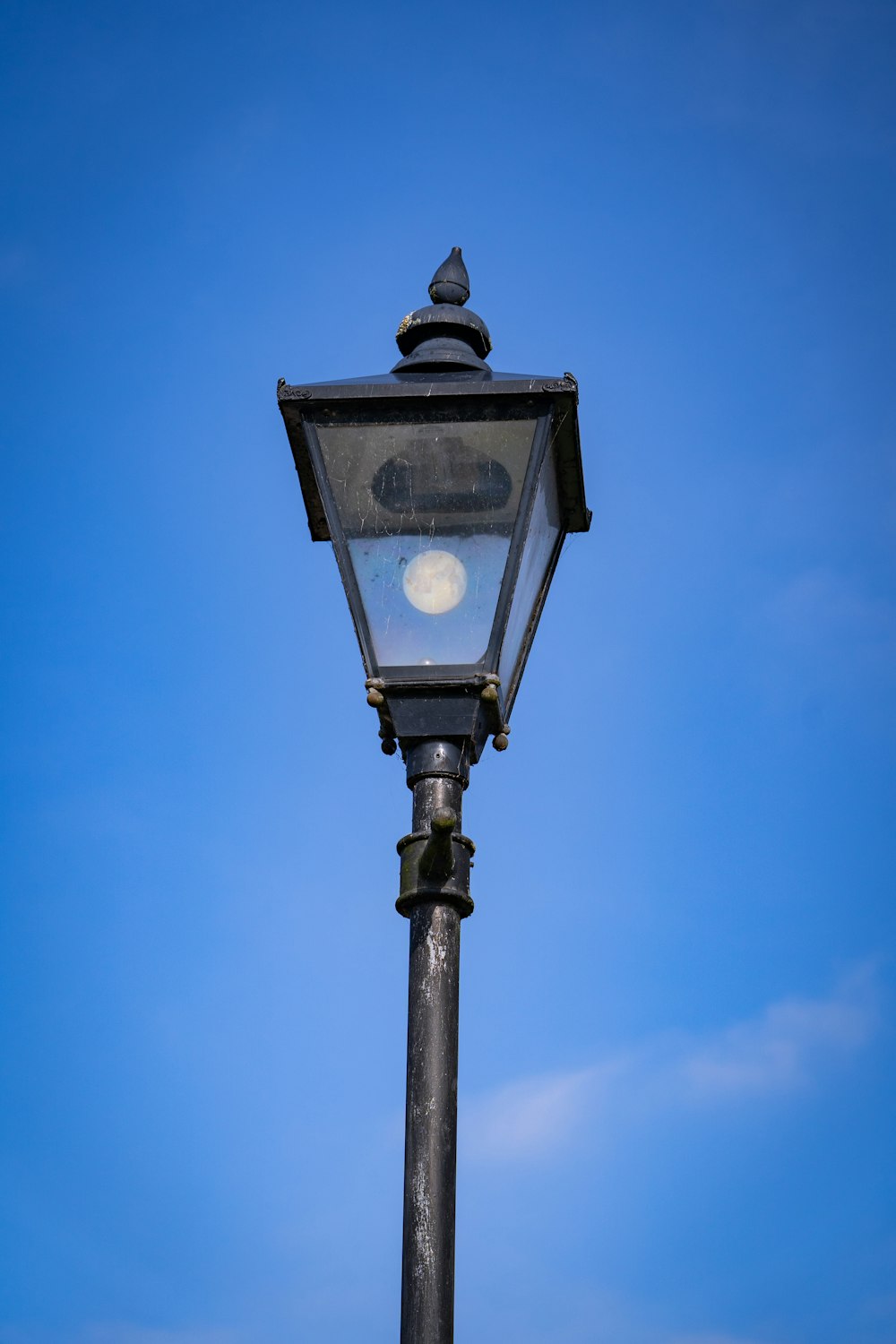 black street light under blue sky during daytime