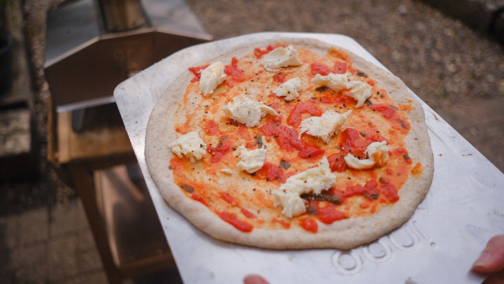 pizza on white paper plate