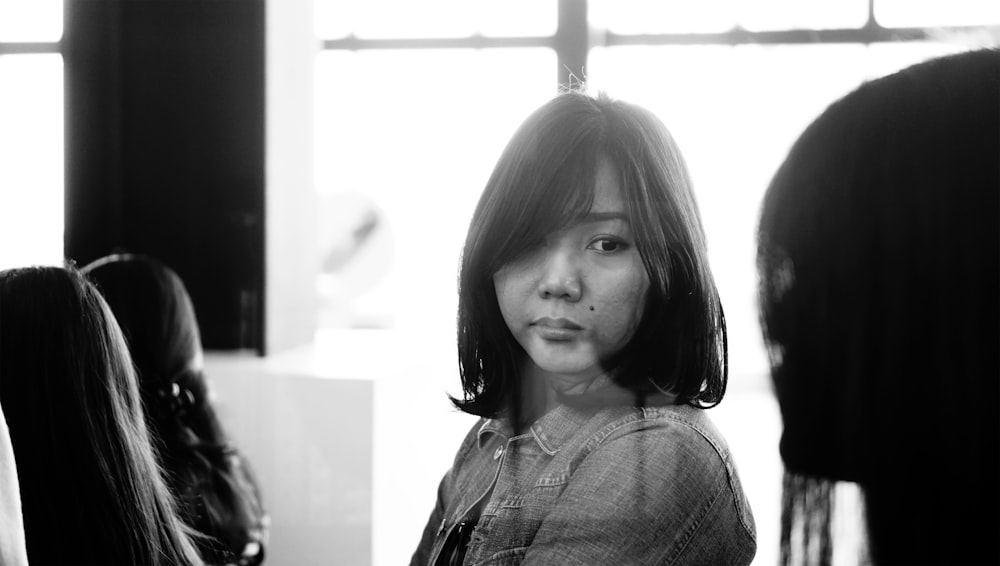 grayscale photo of girl in crew neck shirt