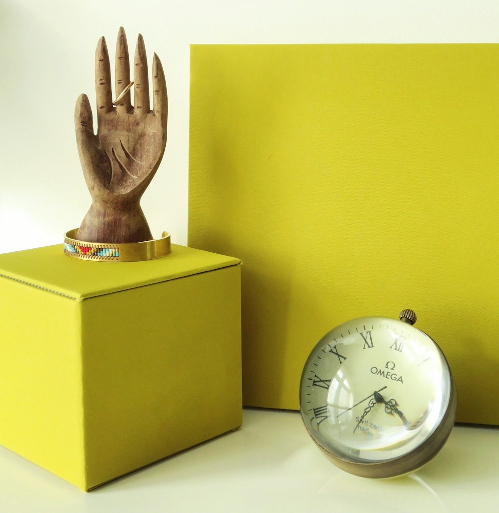 gold and white analog desk clock