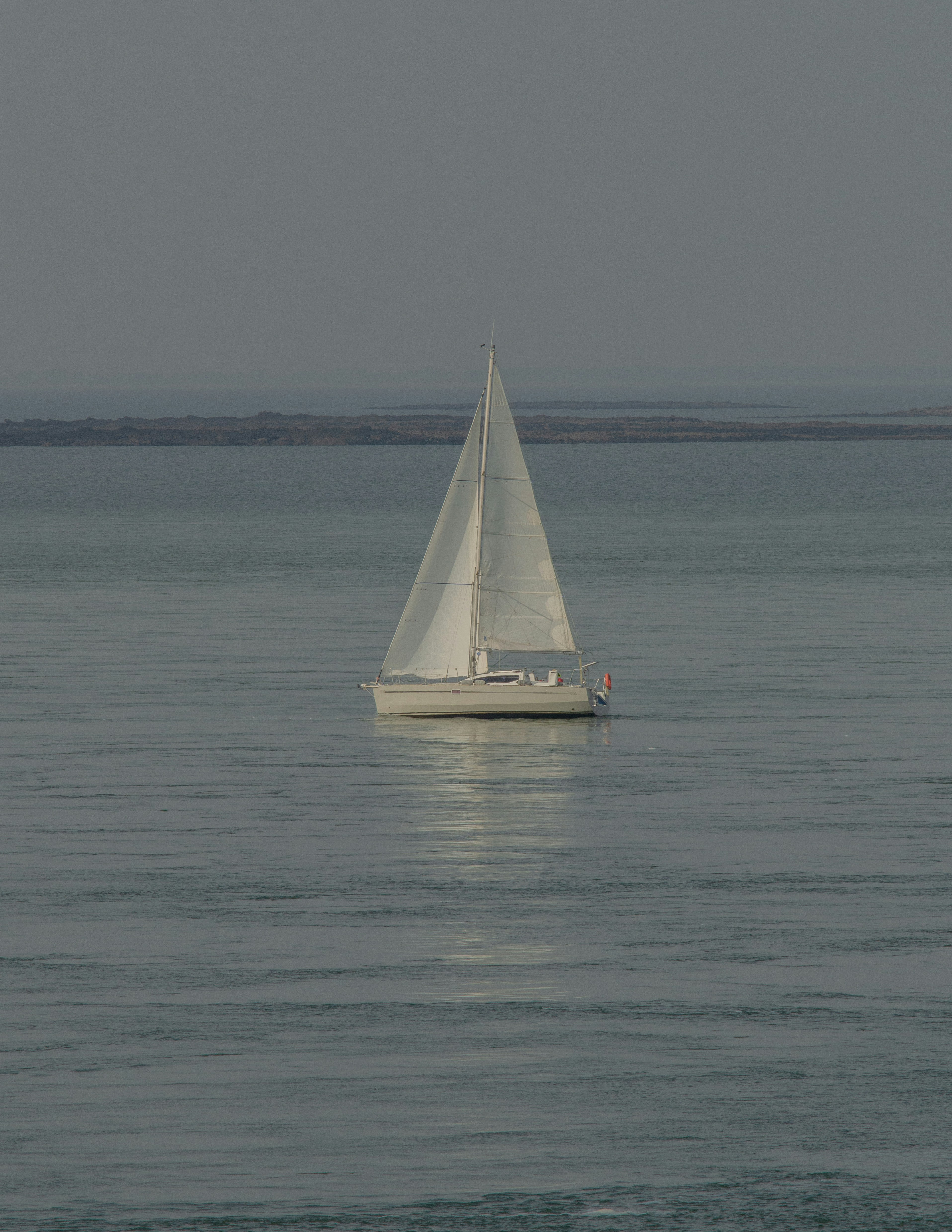 white sailboat on sea during daytime