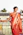 a woman in an orange sari standing on a balcony