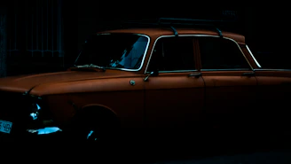 A vintage Japanese coupe with a retro filter, set against a muted cream background evoking nostalgia.