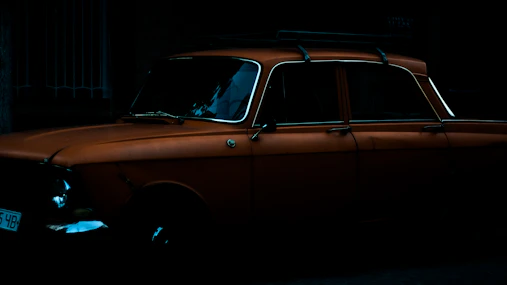 A vintage Japanese coupe with a retro filter, set against a muted cream background evoking nostalgia.