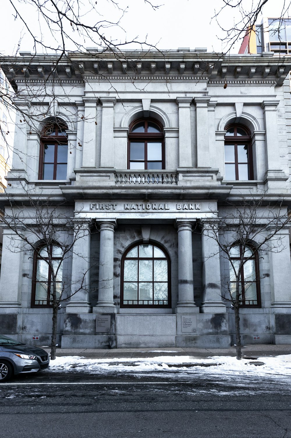 white concrete building with glass window